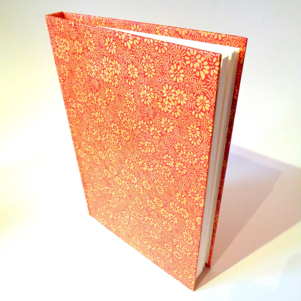 Carnet A5 - 15,5 cm X 22 cm - "Orange à fleurs" - 144 pages